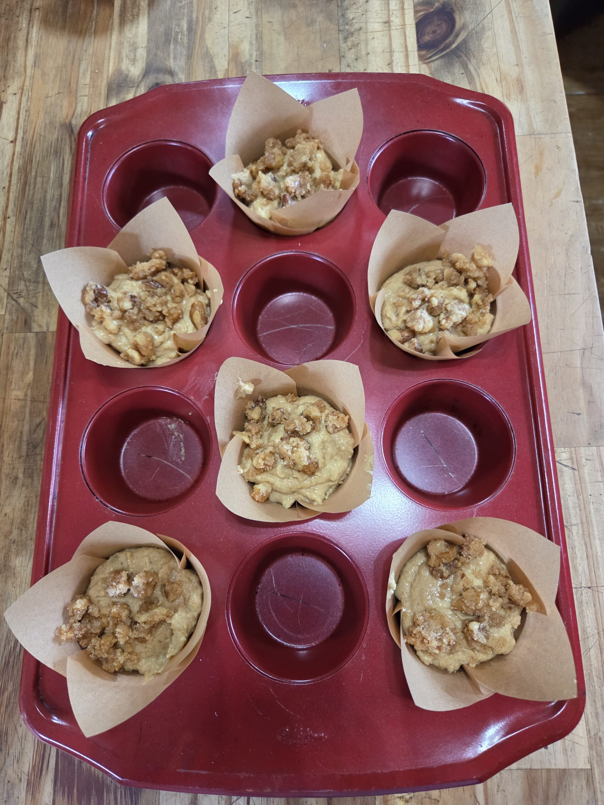 muffin batter in a muffin tin