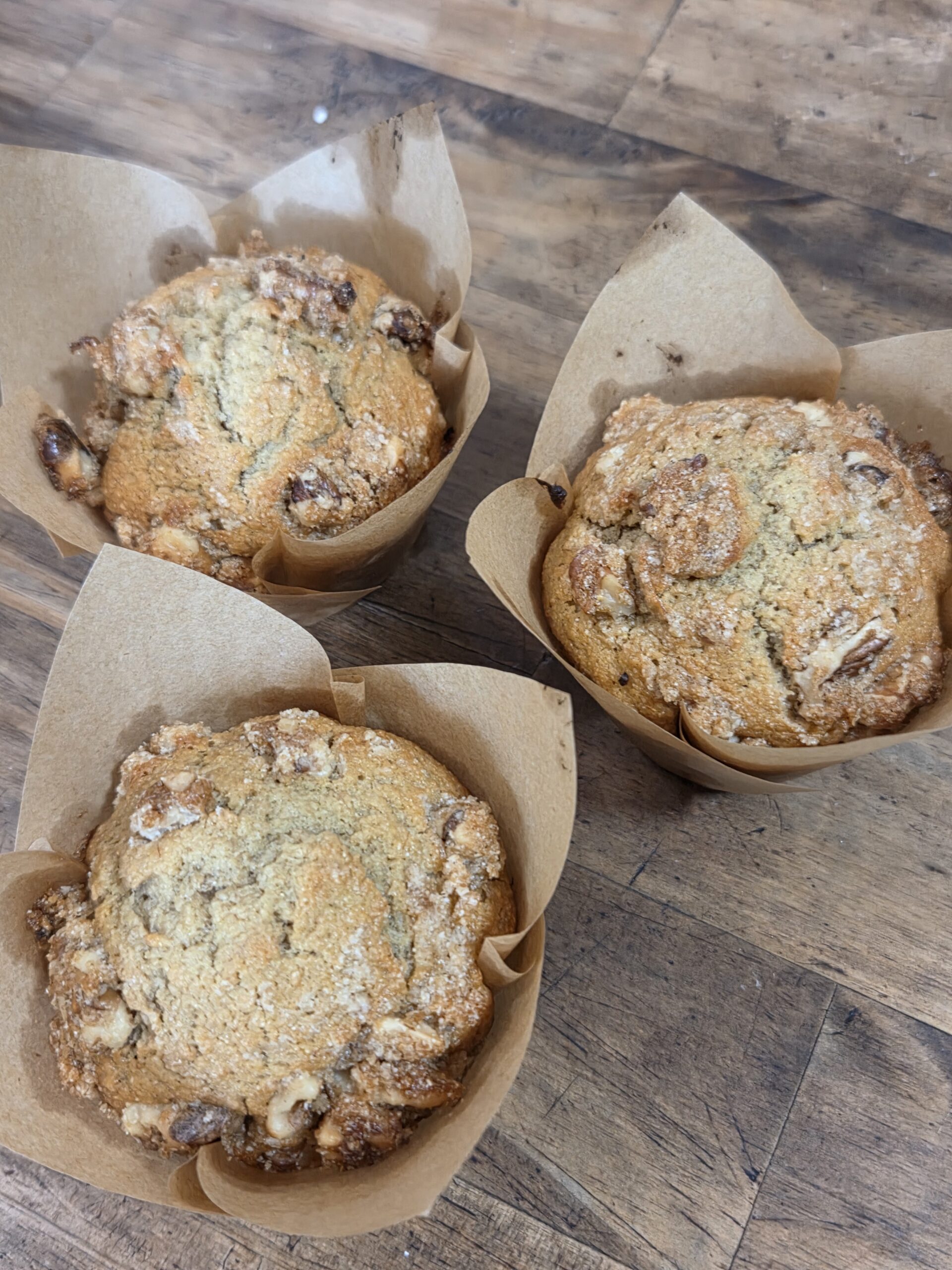 three muffins on a counter