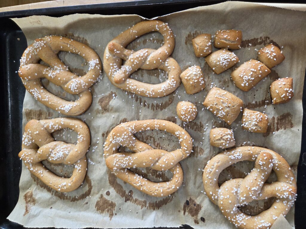 sourdough soft pretzels on cookie sheet