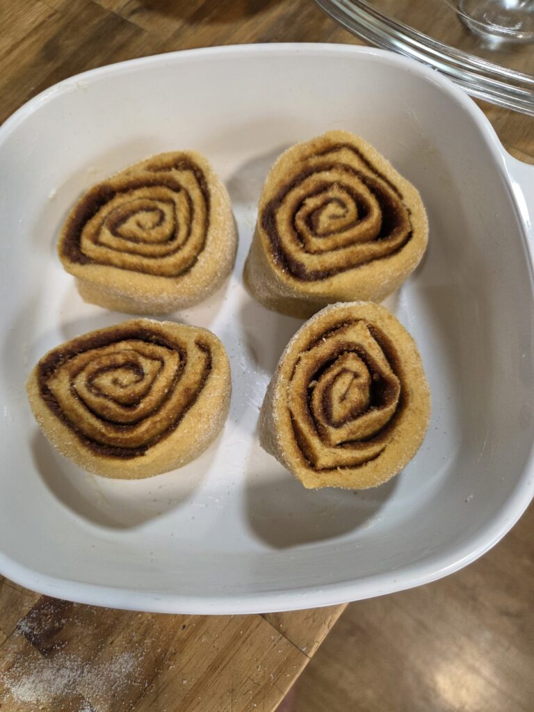 cut cinnamon rolls in pan
