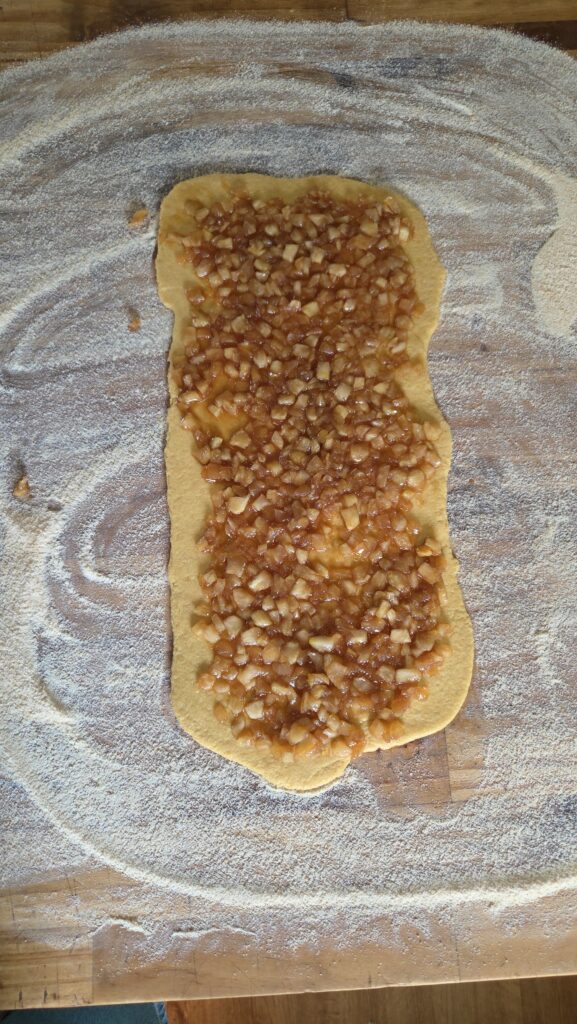 spreading the filling on the dough